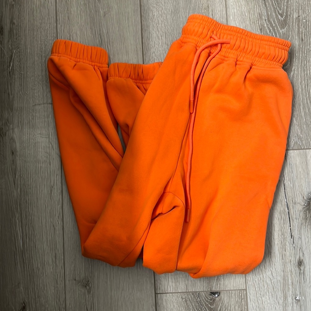 Orange draw string sweat pants